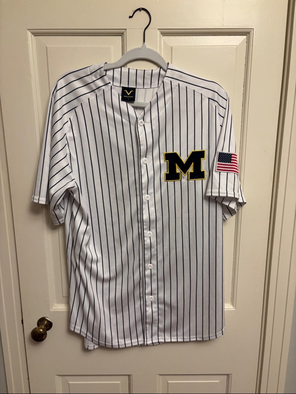 Valiant Pinstripe Baseball Jersey with Navy Stripes and Black/Gold 'M' Patch
